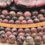 Perle pierre naturelle Rhodonite ronde en 4/6/8/10mm pour création de bijoux et lithothérapie - La Pierre Fr